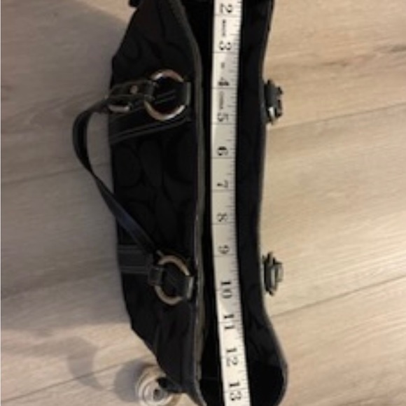 It’s a large signature C coach logo printed all over it - Picture 11 of 15